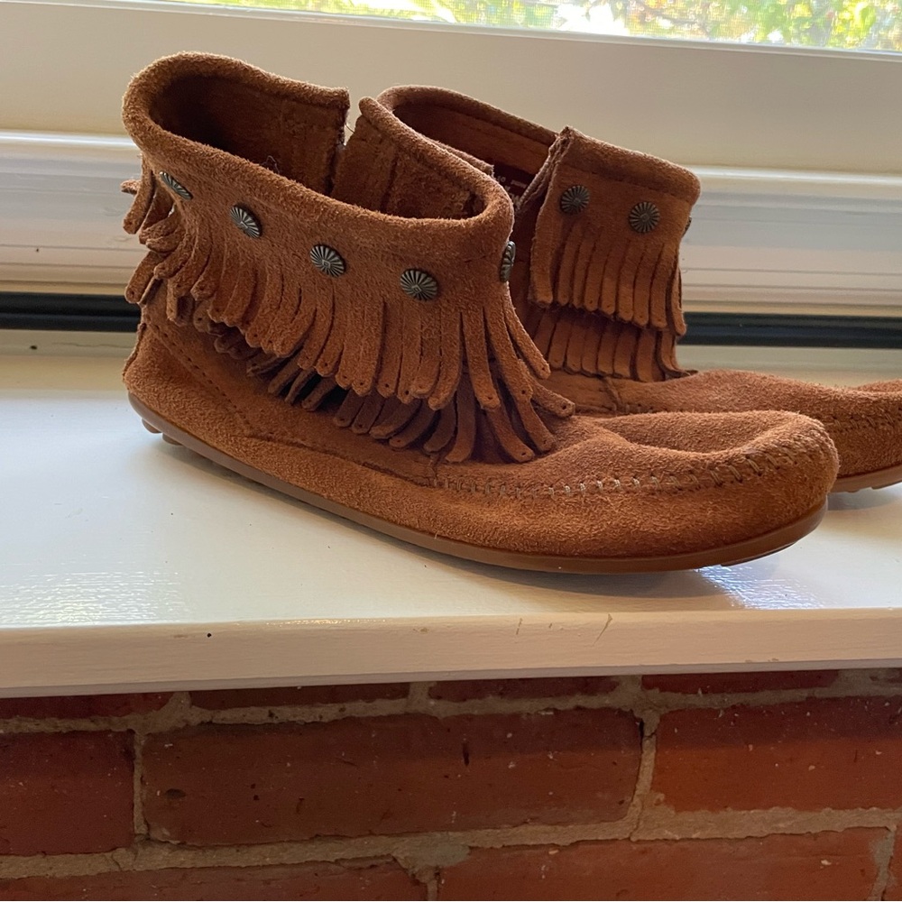 Minnetonka ankle boots. Caramel color with fringe detail. New in Box!